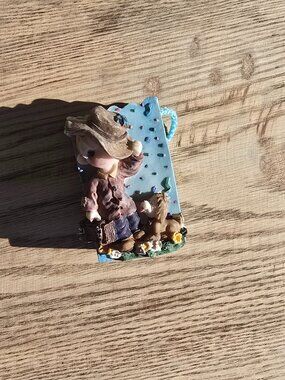 Belle and Benny " A cowboy figurine with a dog"